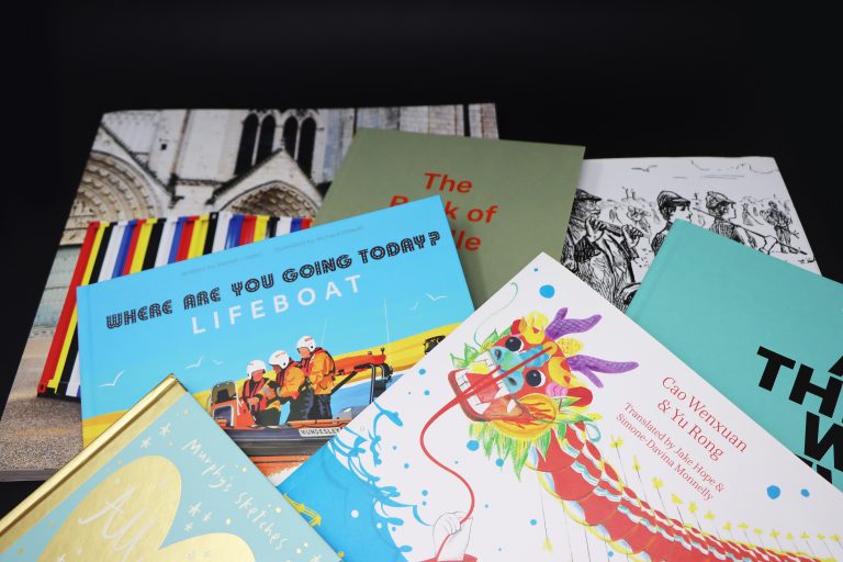 A selection of books on a black background